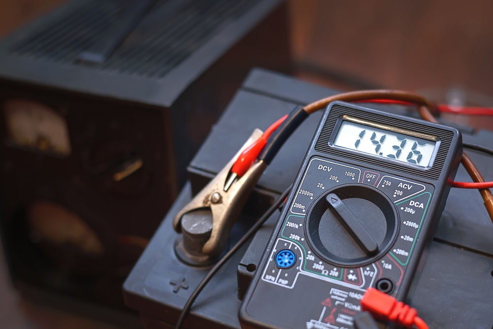 Checking,Voltage,With,Multimeter,And,Charging,Car,Battery,With,Charger