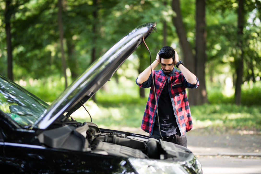 Closeup,Portrait,,Young,Man,Having,Trouble,With,His,Broken,Auto,