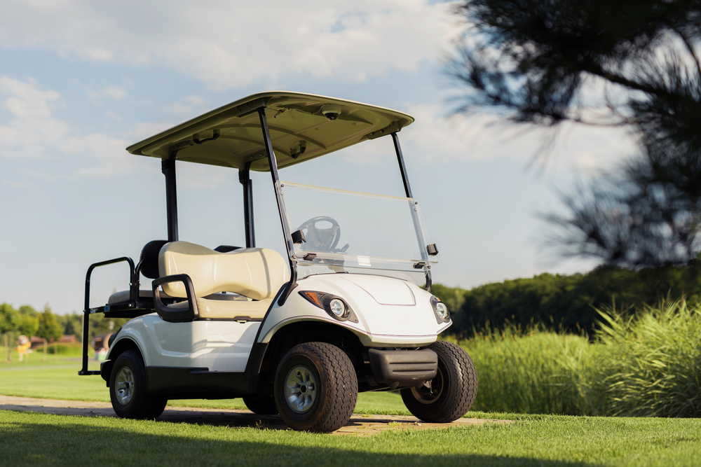 View,From,Low,Angle,,White,Golf,Cart,Stands,On,A