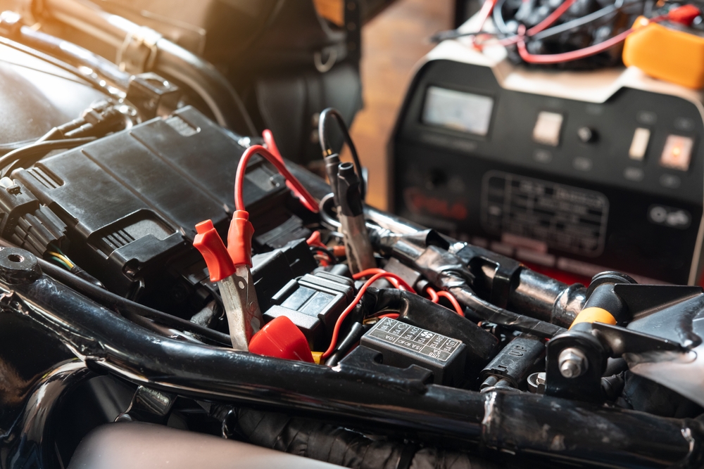 Charging,Motorcycle,Battery,At,Garage,,Selective,Focus,On,Alligator,Clip