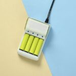 Battery,Charger,With,Aa,Rechargeable,Batteries,On,Blue,Yellow,Pastel